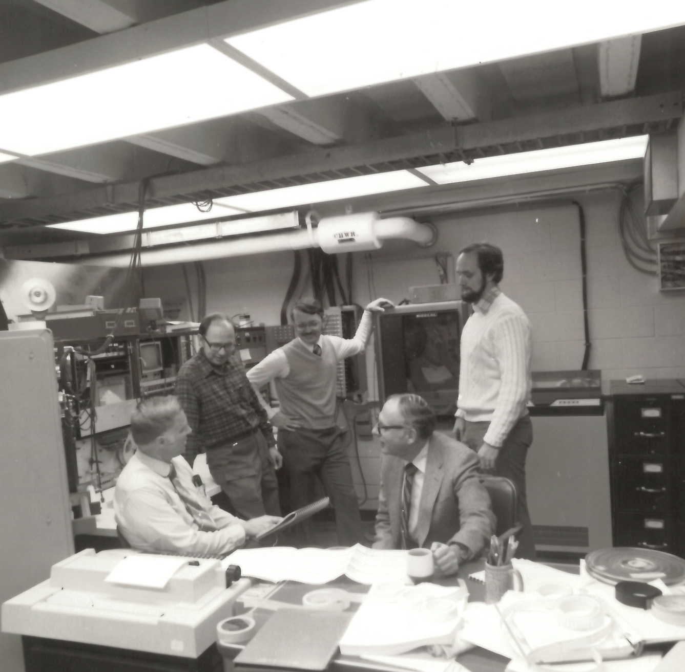 Senior staff reviewing study results, 1980