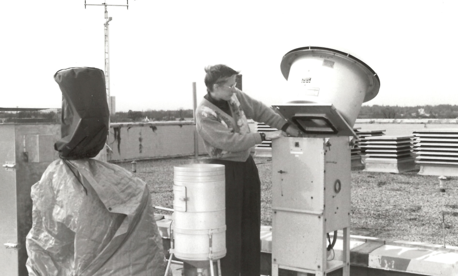 Sue Larson removes filter at air quality sampling site, 1992