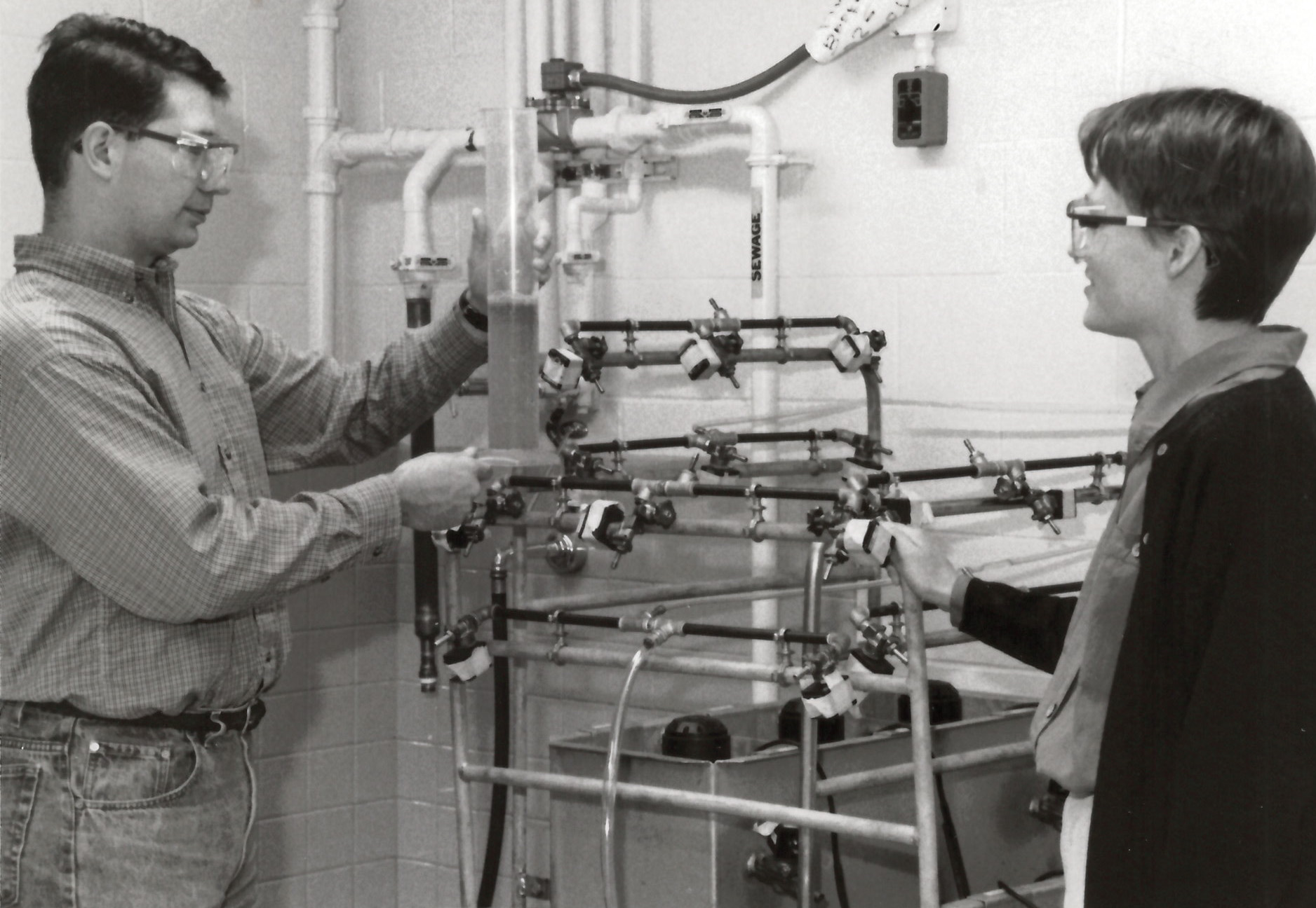 Prof. Lutgarde Raskin discuss wastewater treatment processes with grad student, 1998